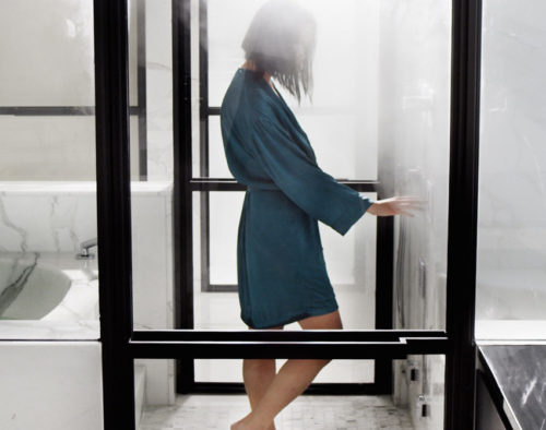 a woman taking a home steam shower